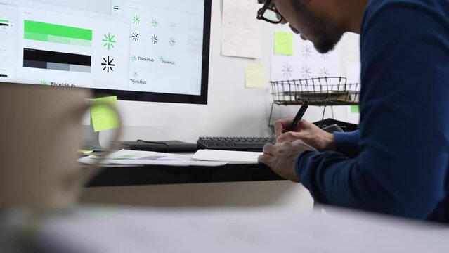 Young Asian Graphic designer working in office. Designing logo Artist Creative Designer Illustrator Graphic Skill Concept.