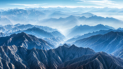 a panoramic view of fold mountains with layers of ridges and valleys extending to the horizon