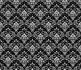 Wallpaper in the style of Baroque. Seamless vector background. White and black floral ornament. Graphic pattern for fabric, wallpaper, packaging. Ornate Damask flower ornament.