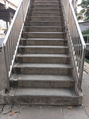 Fototapeta premium The concrete staircase of the overpass bridge.