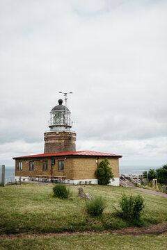 Kullen - Historic lighthouse on a grassy hill in Sweden