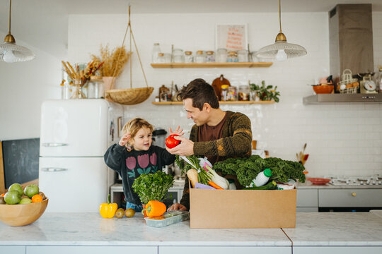 Dad learning daughter how to cook