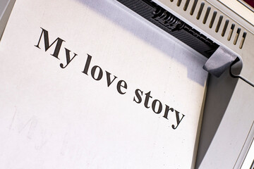 Sheet of paper on an office printer with the inscription My love story