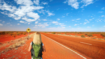 A blonde haired woman in the outback of Australia's Northern Territory.	