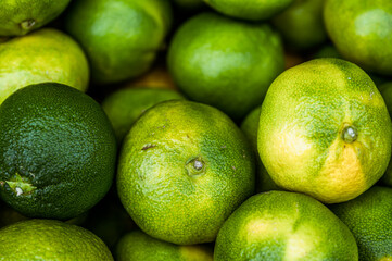 Fresh green limes on the market