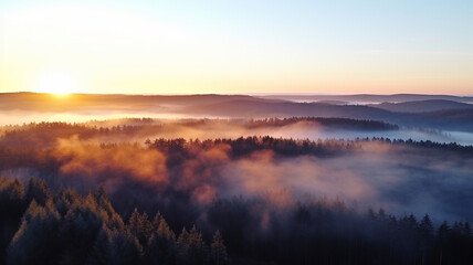 Obraz premium Dawn over the forest. View from a drone.