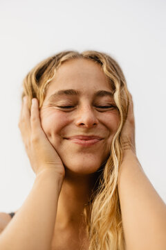 portrait of a happy woman with natural wavy blonde hair 