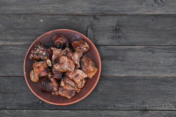 pork ribs cooked on the grill are in a plate. copy space