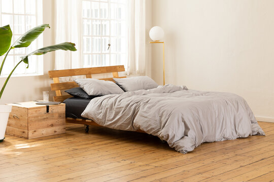 Bed in sunny apartment. 