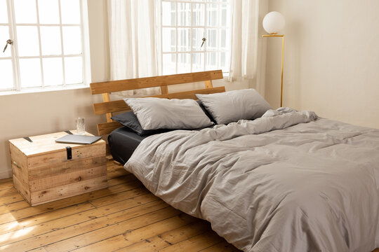 Bed in sunny apartment. 