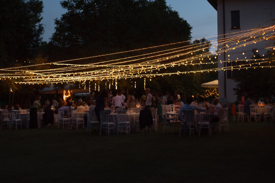 Anonymous people banqueting outdoor