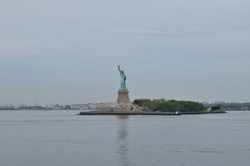 The Statue of Liberty, a lasting symbol of freedom and hope, rises above the waters, welcoming all to the shores of New York City © Enrique