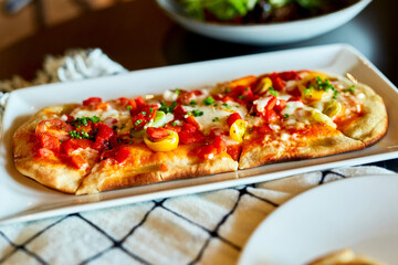 Savory Brunch Flatbread Pizza Served on Plate at Restaurant