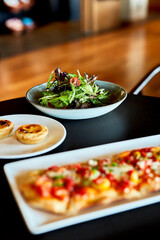Savory Brunch Flatbread Pizza Served on Plate at Restaurant
