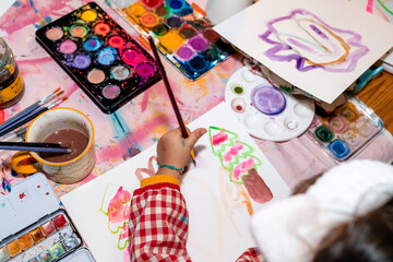 Little Girl having fun painting and drawing