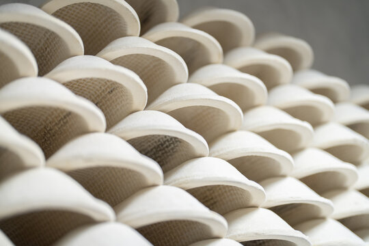 Lot of clay forms for baking lie on each other