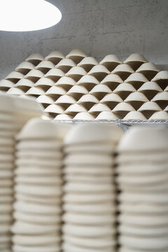 Lot of clay forms for baking lie on each other