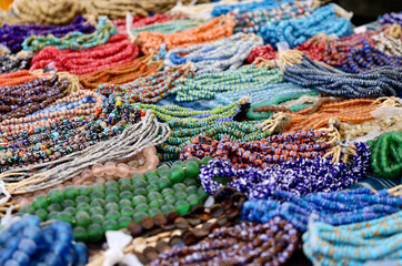 closeup detail of colorful strands of assorted beads