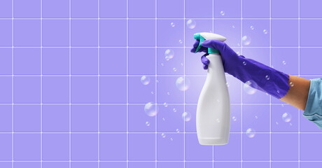 Female hand holding a spray detergent