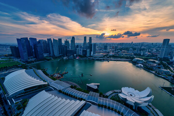 Singapore Skyline and view of skyscrapers on Marina Bay at sunset.