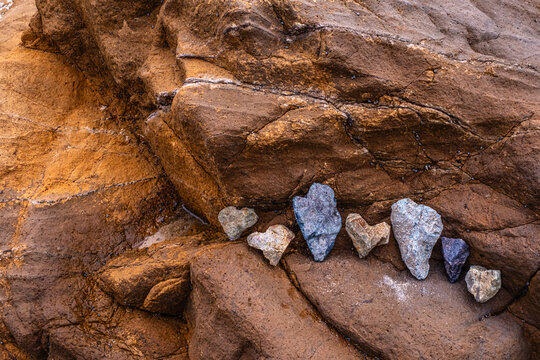 A grouping of heart-shaped rocks on a rocky outcropping