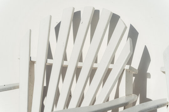 White Wooden Adirondack Chair. Quiet summer