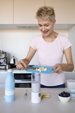 Woman making smoothie