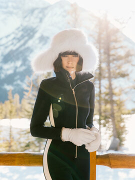 Winter portraits of the woman with a mountain view