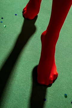 Red Tights on Green Pool Table with Dramatic Shadow