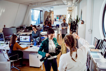 Two fashion designers working together on a project in a design studio - Powered by Adobe