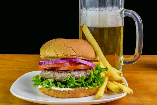 hamburger  with lettuce, tomatoes and onions