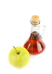 Apple vinegar in a bottle and fresh apples isolated on a white. Vertical photo