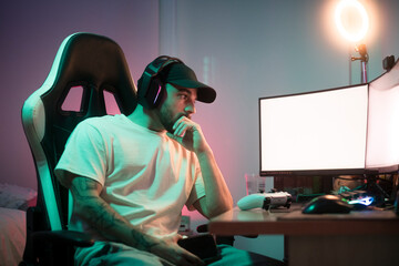 Serious gamer looking at the screen during a break