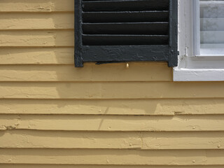 Details on a colorful yellow home found in Kennebunkport Maine