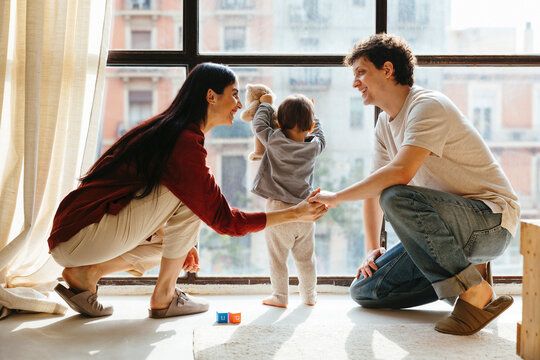 Loving couple and baby boy at home