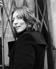 Black and white portrait of woman looking at camera.