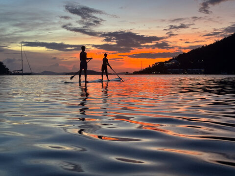 Paddle boards at sunset
