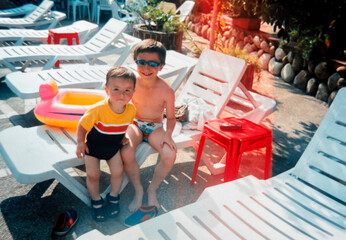 Brothers in swimsuits