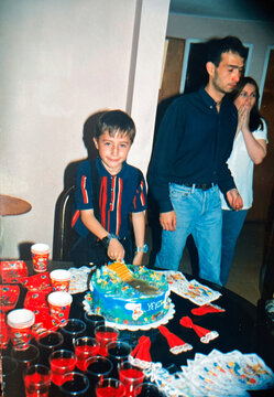 Child breaking his birthday cake