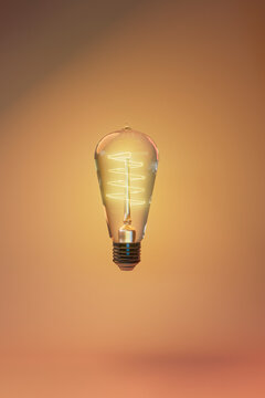 Glowing Edison Bulb Concept on Gradient Background