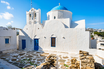 White church with blue dome and doors in Apollonia village, Sifnos island, Greece