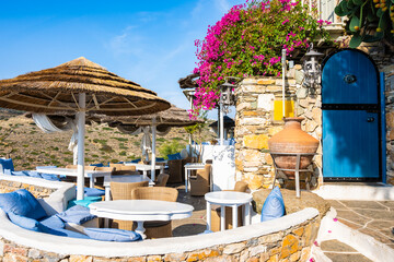 Cafe restaurant with sun umbrellas and beautiful mountain view in Kastro village, Sifnos island,...