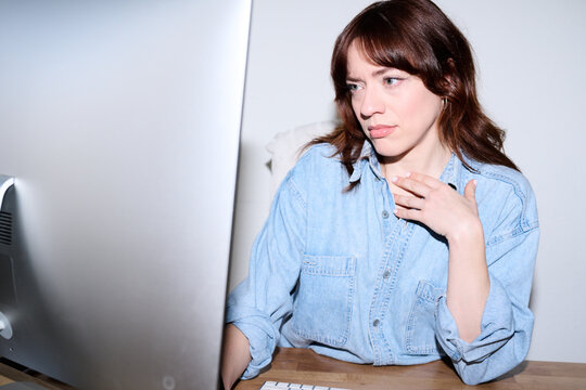 Thoughtful Professional at Workstation