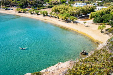 View of Marina Gialos bay beach with azure crystal clear turquoise sea water, Sifnos island, Greece