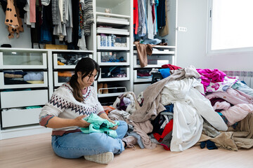 Woman Organizing Messy Closet