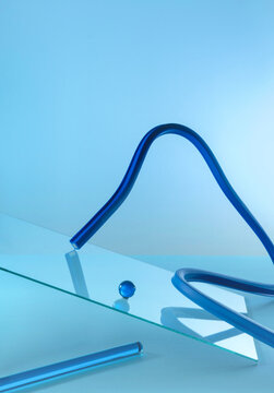Abstract blue background with geometric shapes. Lines, glass, spheres