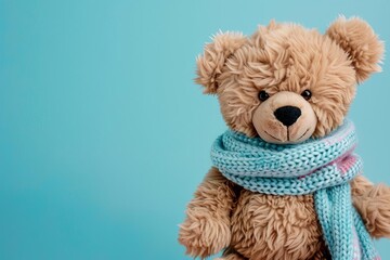 big teddy bear wearing scarf standing on pastel background childhood toy concept