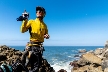 Rock climbing guide pointing