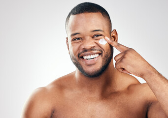 Black man, face cream and portrait in studio for beauty with application, cosmetics and pride by...