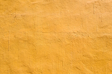 Textured yellow wall surface